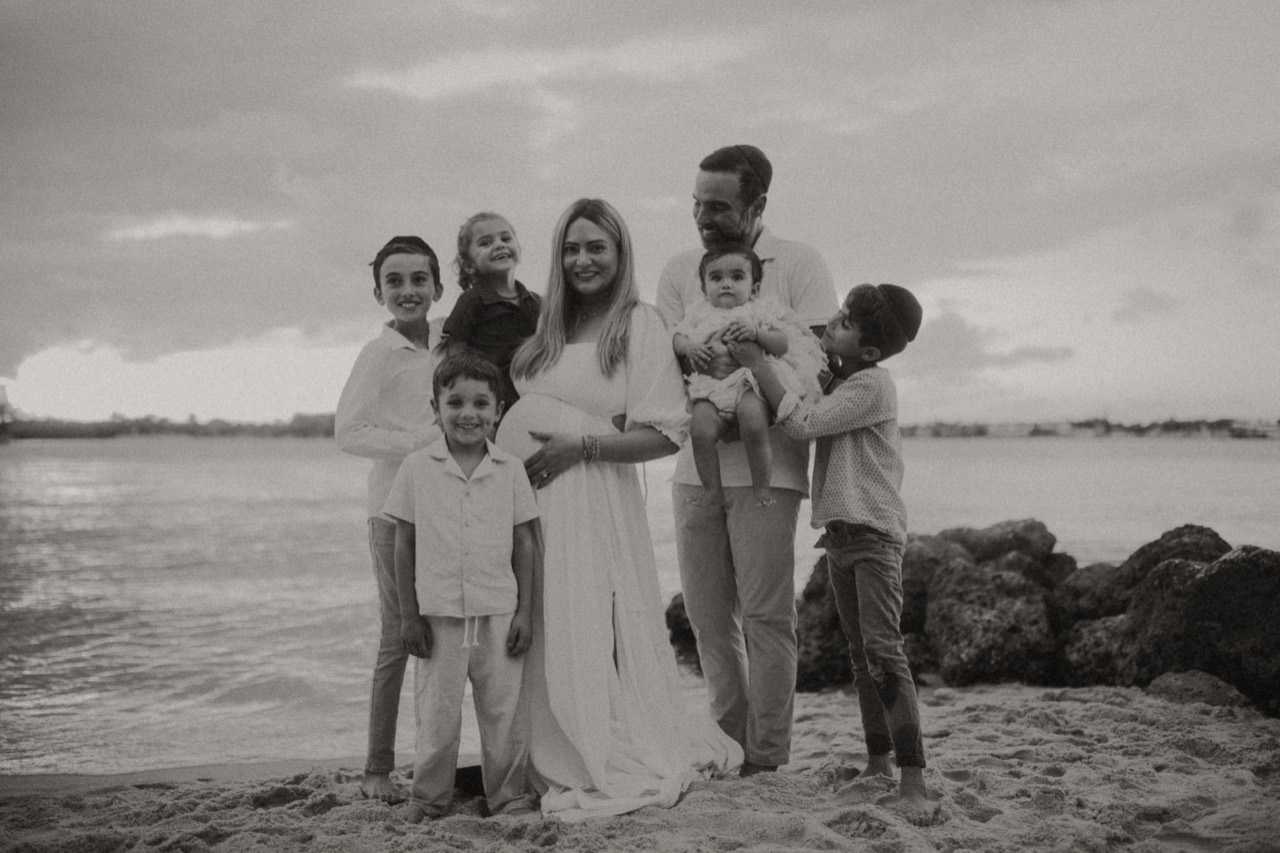 Taliya Corbett with her family by the water
